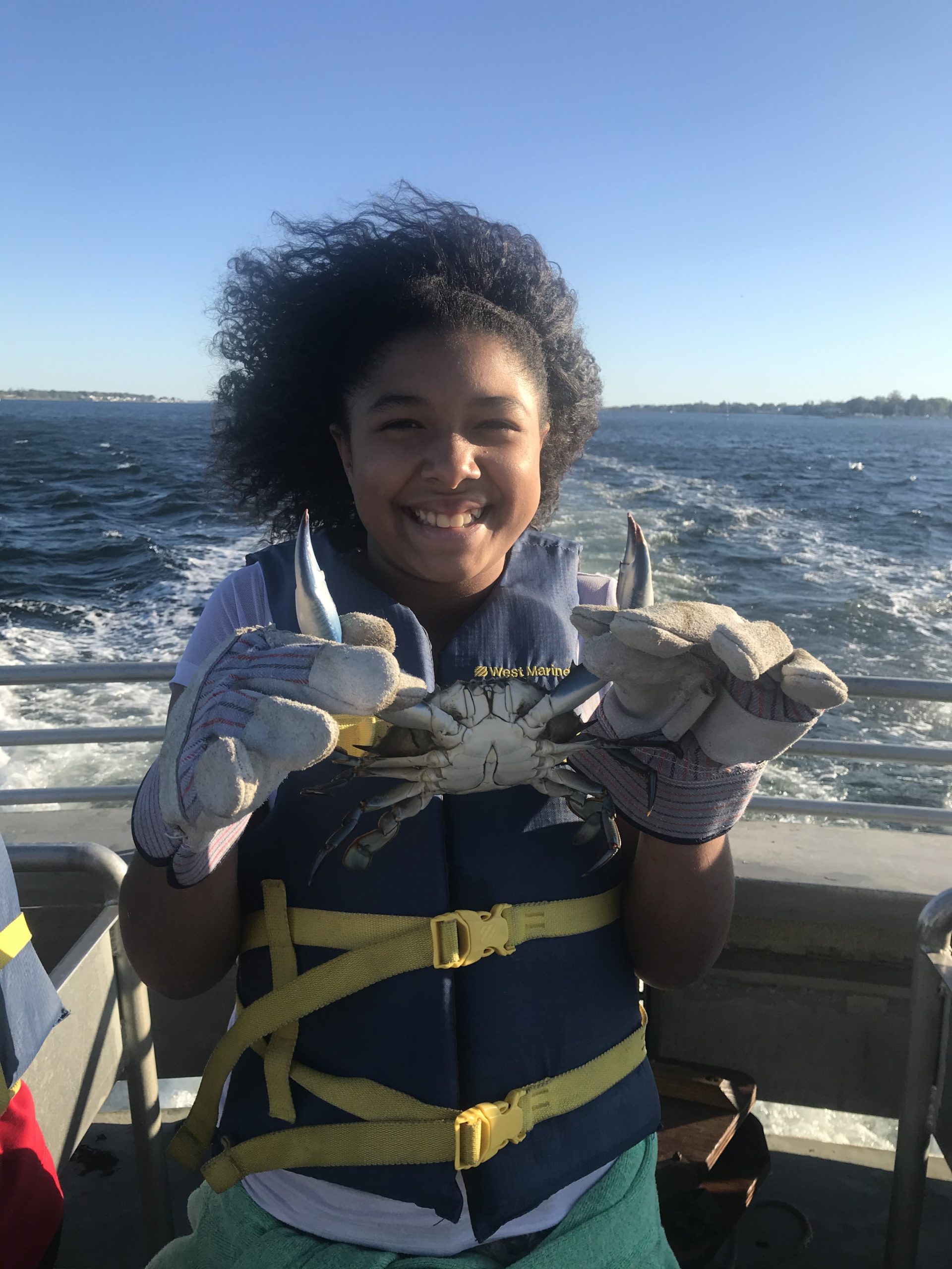 Student-with-crab-from-trawl-on-boat