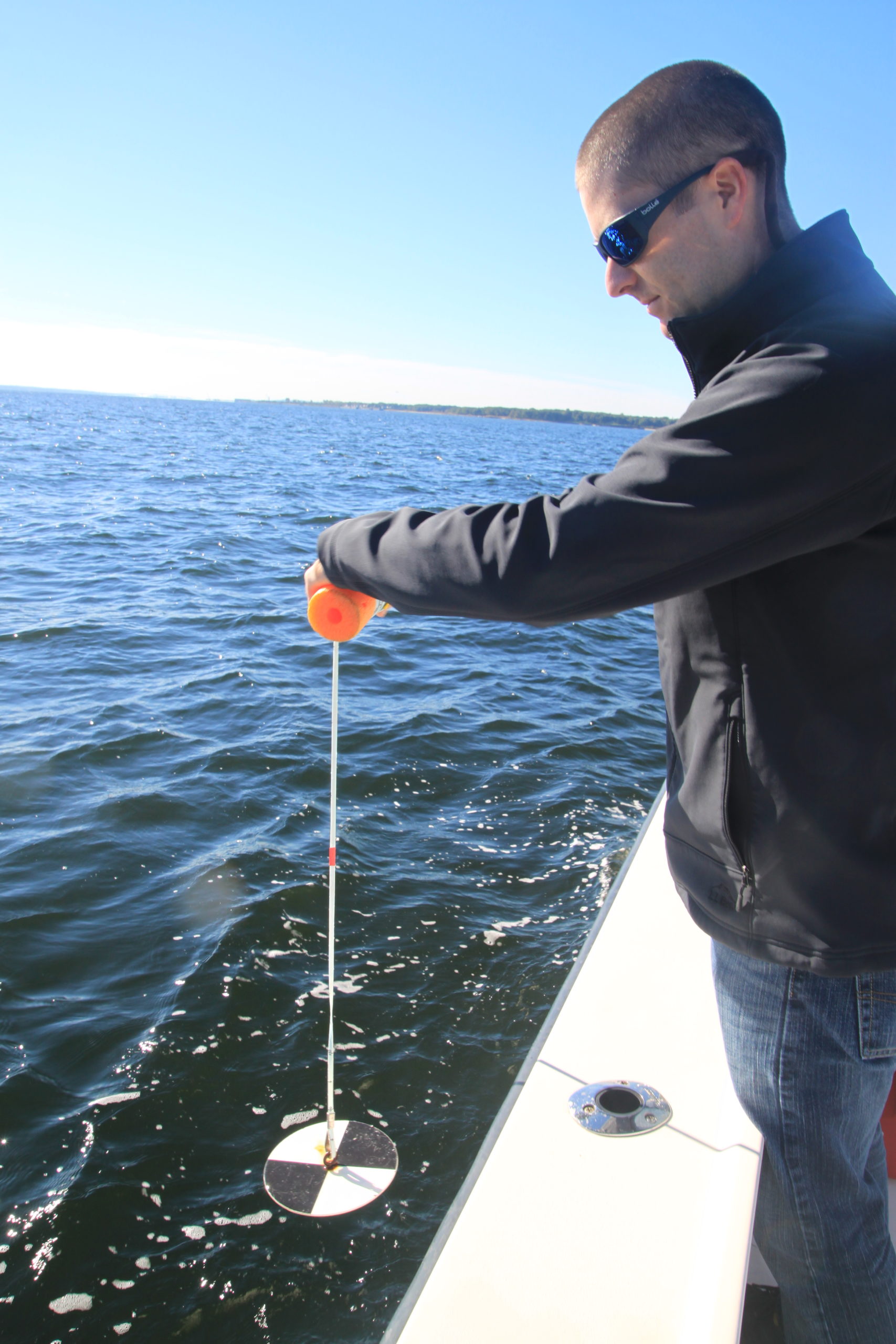 Mike-Jarbeau-testing-water-quality-on-boat