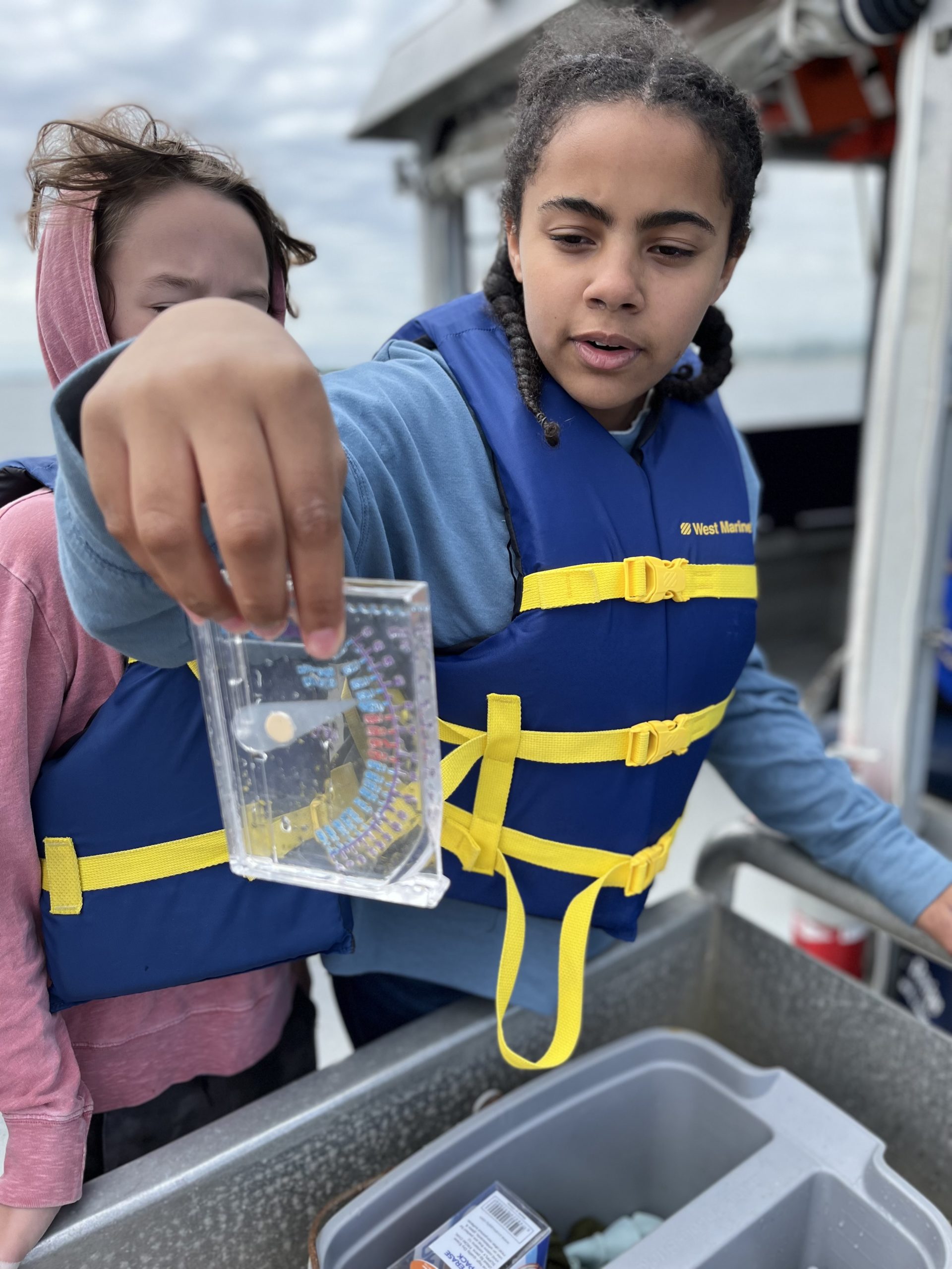 students_on_vessel_test_water_quality